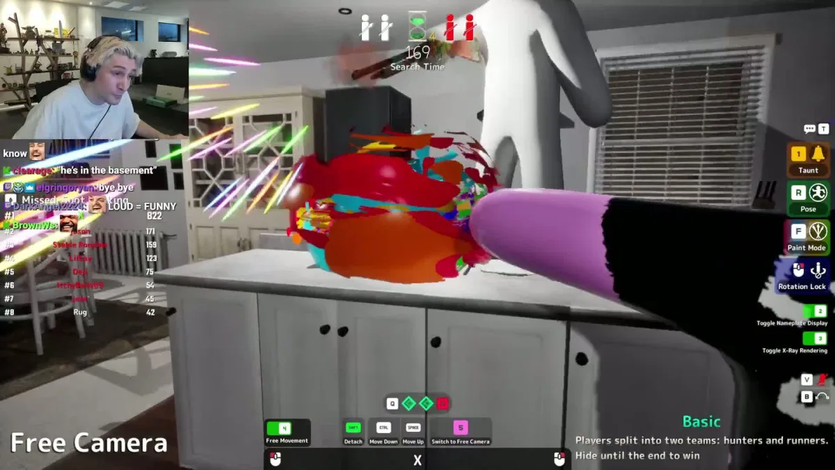 Streamer playing colorful action game in kitchen scene