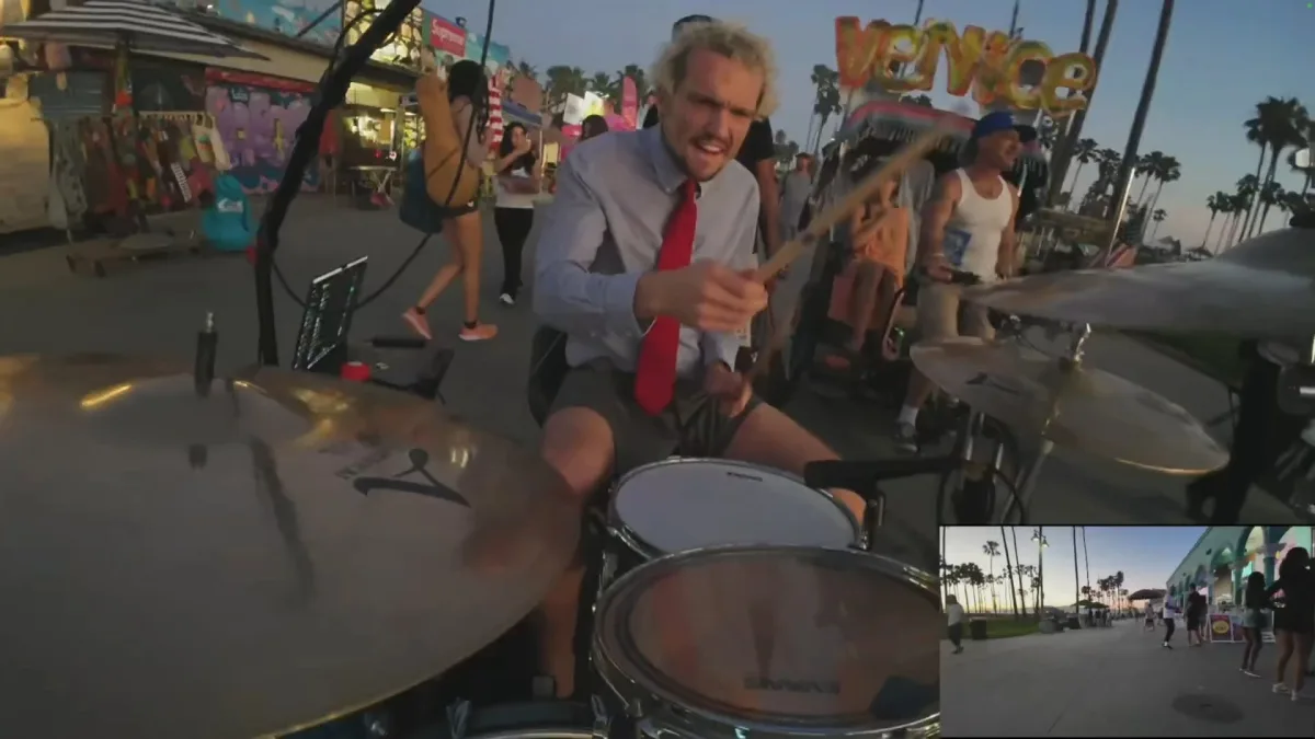 Man playing drums on Venice Beach boardwalk