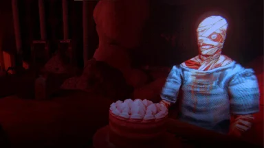 Mummy figure with cake in eerie red light