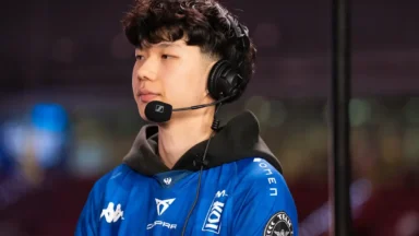 Esports player wearing headset and blue team jersey
