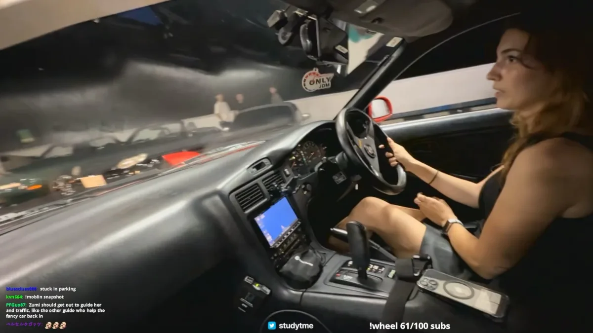 Woman driving a car in an underground garage
