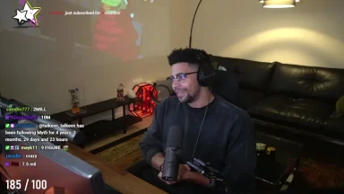 Streamer smiling during live session at desk