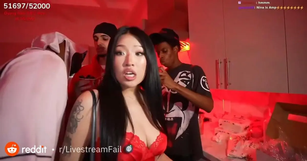 People in red-lit room streaming live event