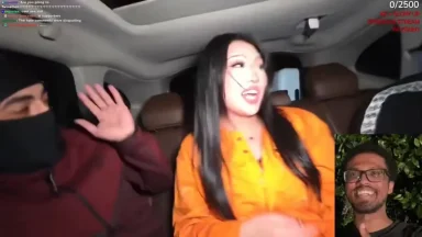 Two people talking inside a car during livestream.