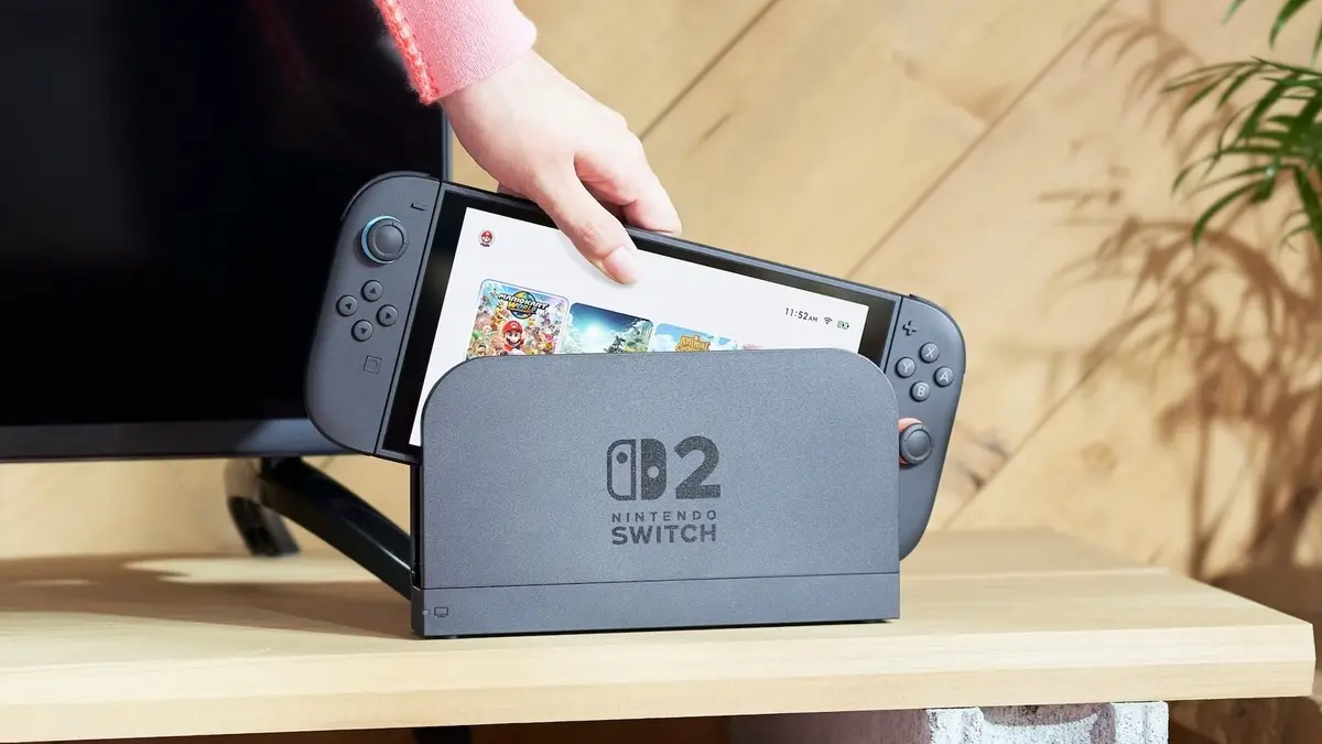 Hand placing Nintendo Switch 2 into dock