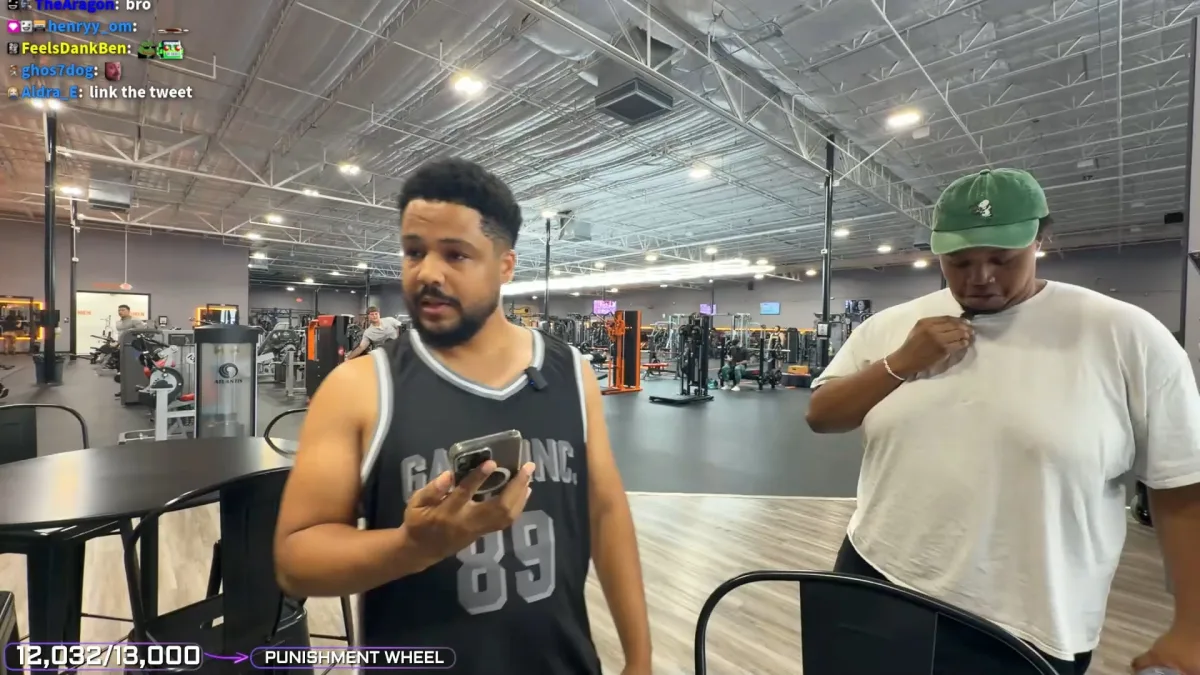 Two men standing in a spacious gym