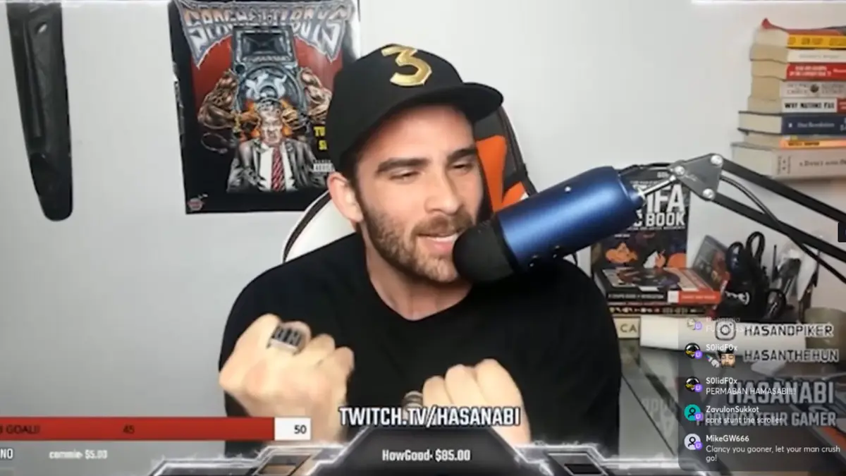 Streamer talking into microphone during live broadcast.