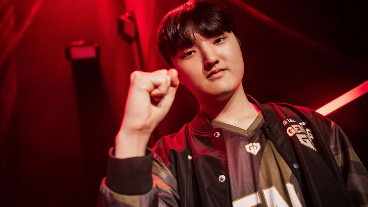 Esports player raising fist under red light