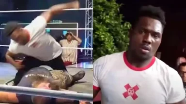 Wrestler punching opponent inside ring during match