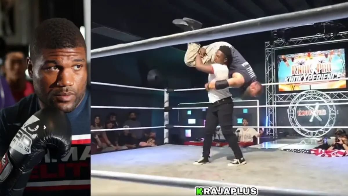 Boxer and wrestler in ring during event.