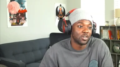 Man wearing headset and beanie indoors