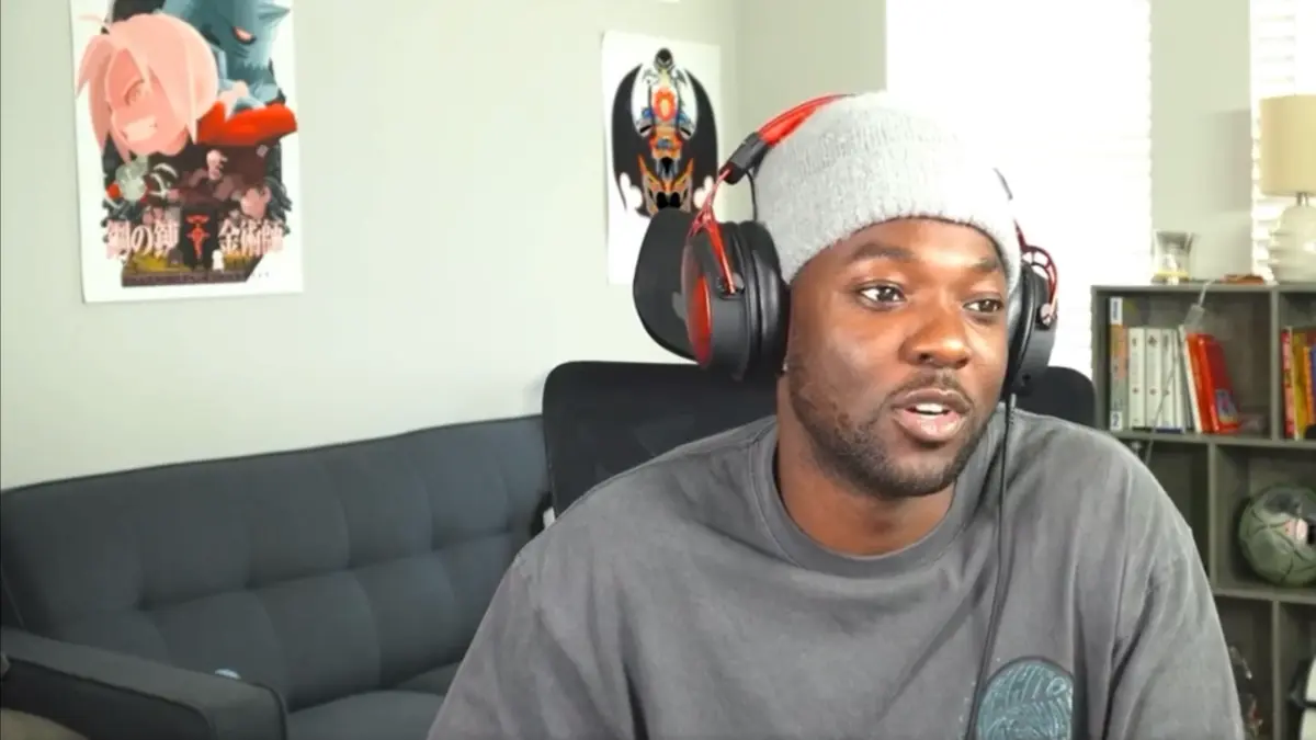 Man wearing headset and beanie indoors