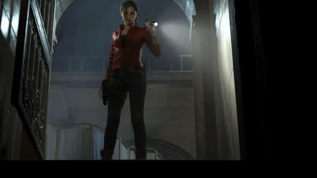 Woman with flashlight in dark stairwell