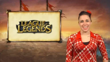 Presenter beside League of Legends logo backdrop