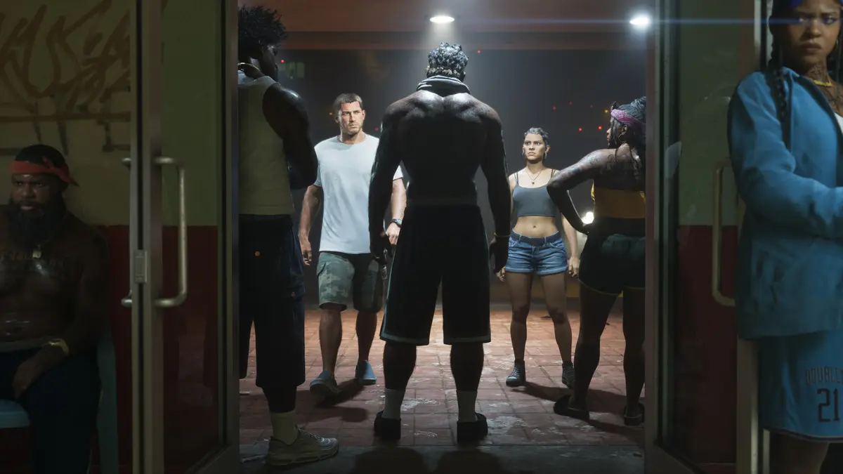 Athletes confront each other in a dimly lit gym hallway.
