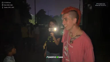 People filming at night in New Delhi street