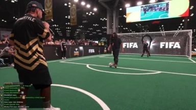 Indoor FIFA event with man taking penalty kick