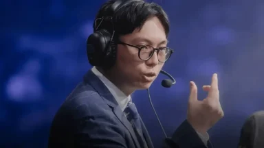 Esports commentator speaking with headset on stage