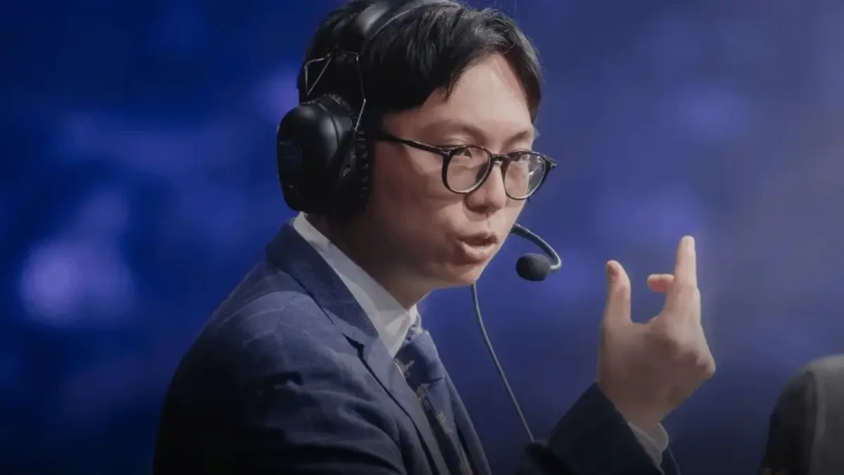 Esports commentator speaking with headset on stage