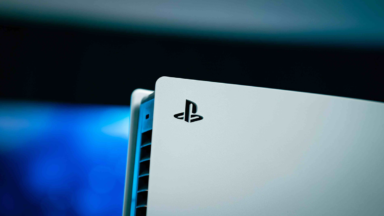 Close-up of white PlayStation 5 console with logo