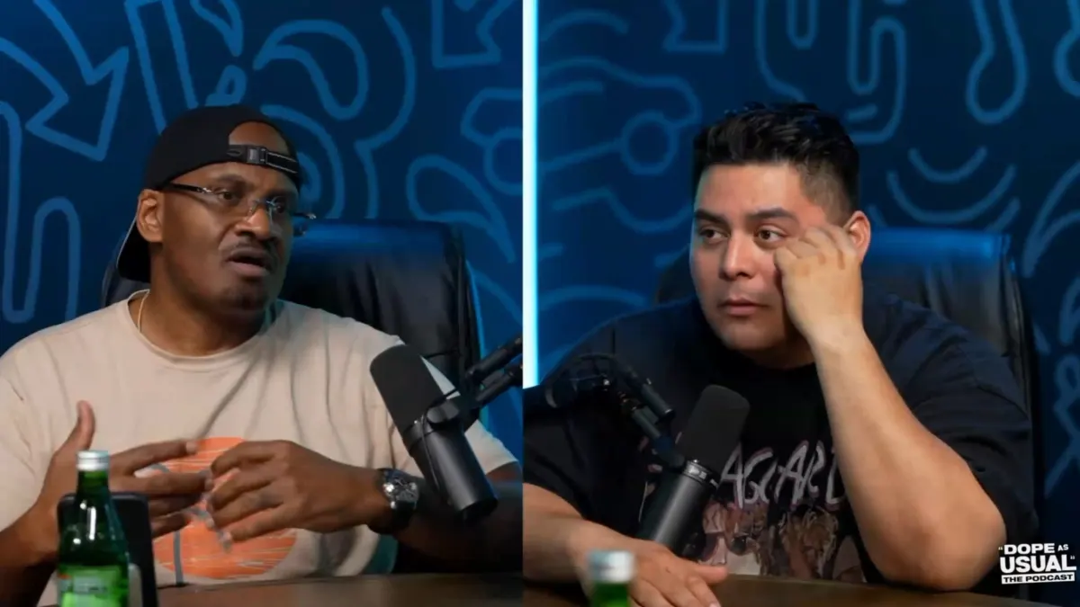 Two men speaking into microphones on a podcast set