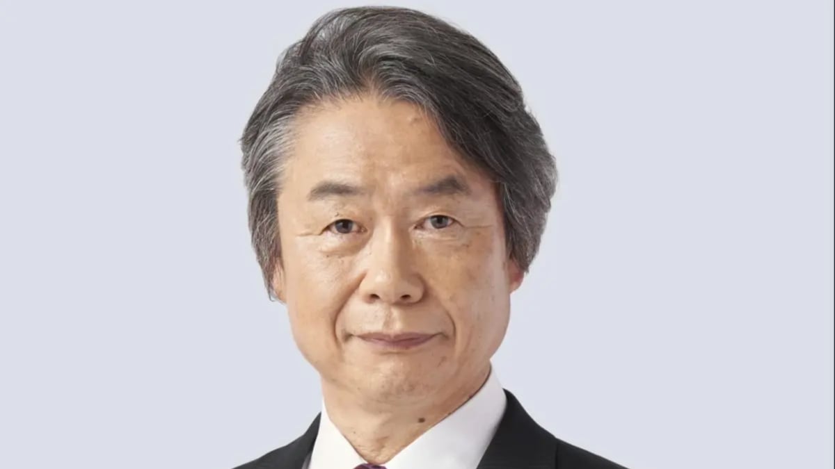 Formal headshot of an older Asian man in a suit