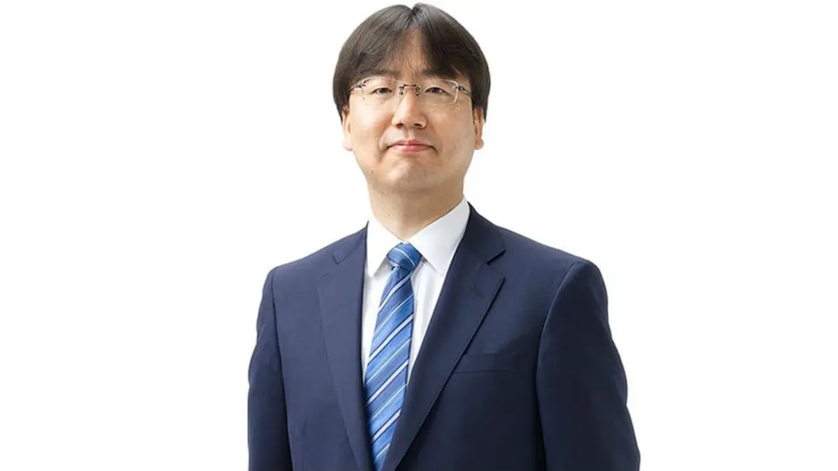 Person in blue suit and striped tie