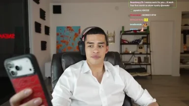 Man streaming while looking at phone screen