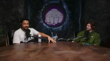 Two people recording a podcast in studio