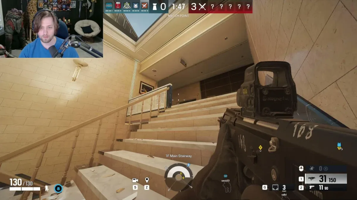 First-person shooter gameplay with streamer facecam overlay