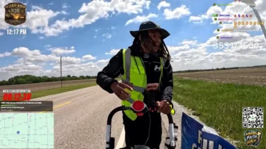 Man livestreaming walk along rural highway
