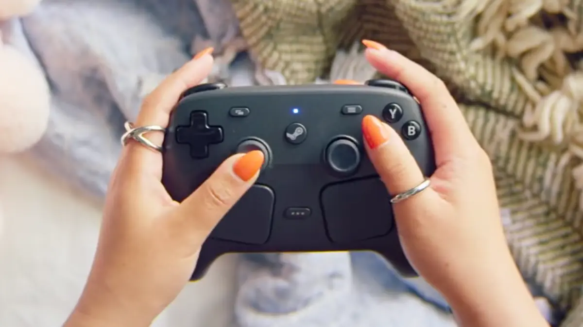 Hands holding a black gaming controller
