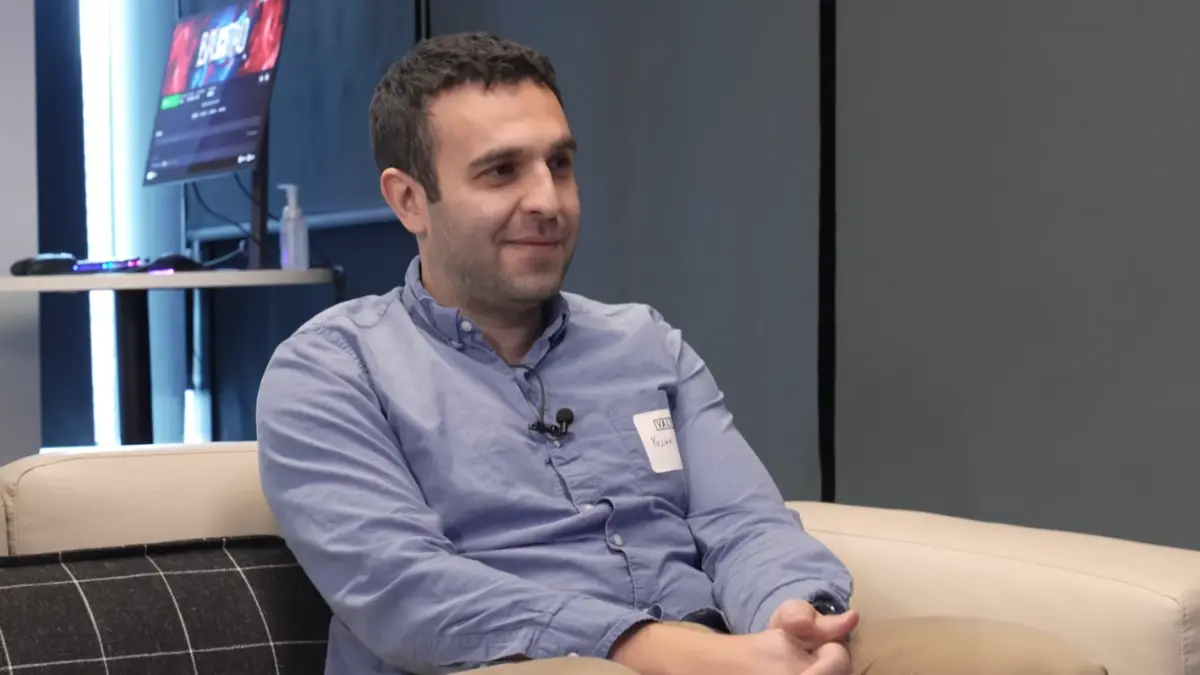 Man sitting on couch during an interview