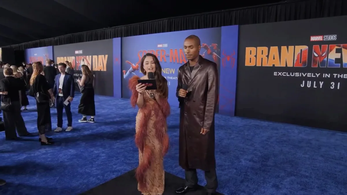 Interviewer and guest at Spider-Man movie premiere