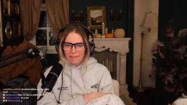 Person streaming with microphone and headset indoors