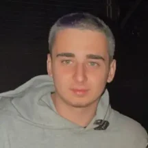 Young man wearing a gray hoodie