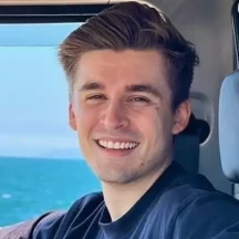 Man looking up against blue background