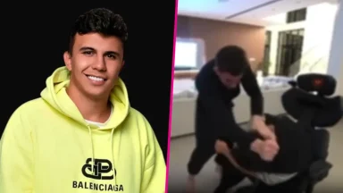 Man in hoodie and people fighting indoors