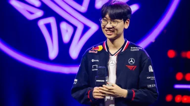 Smiling esports player holding microphone on stage
