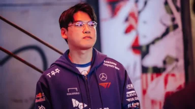 Young man in esports jacket under stage lights