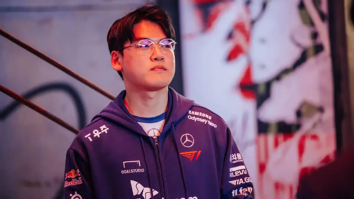 Young man in esports jacket under stage lights