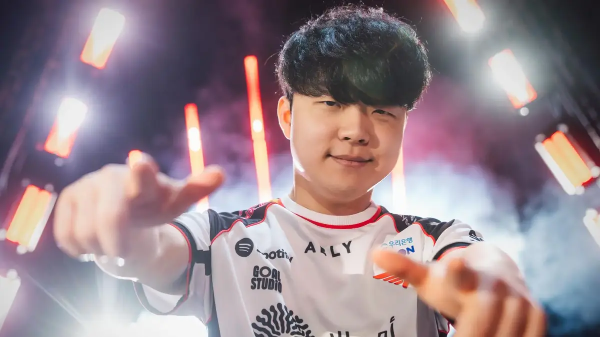 Esports player pointing at camera under stage lights