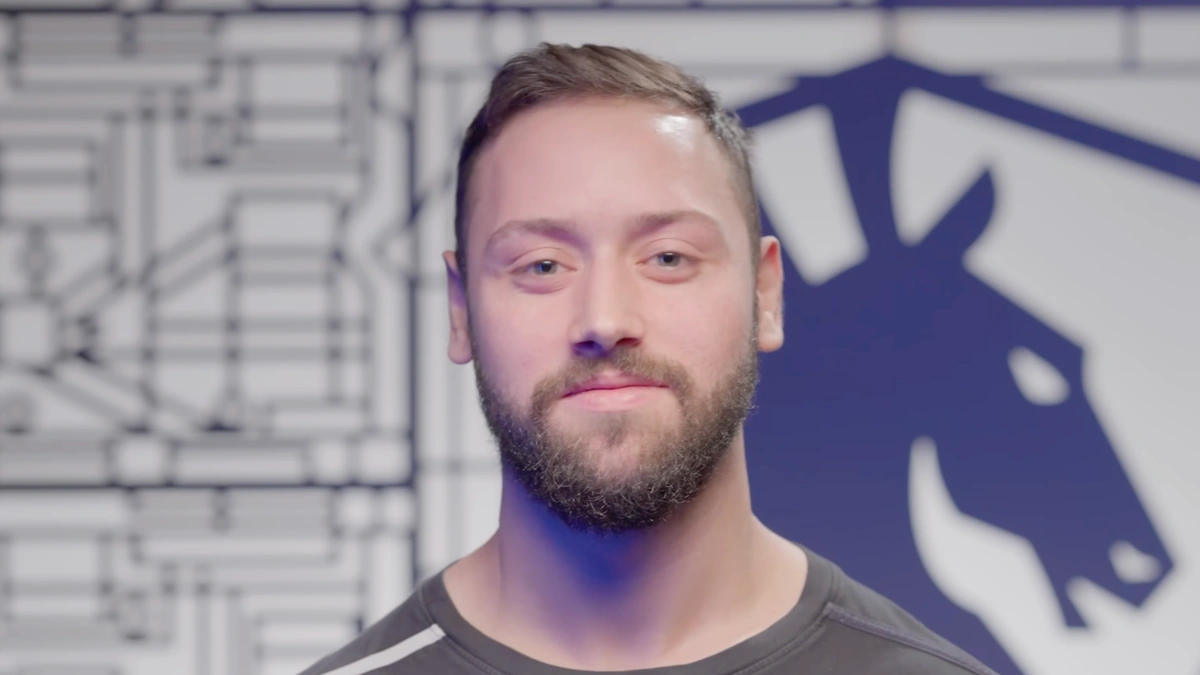 Smiling man in front of abstract wall design