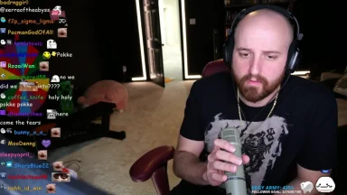 Streamer with microphone during livestream with chat visible