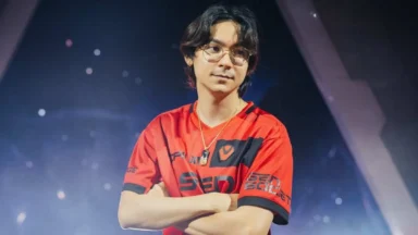 Young man in red esports jersey on stage