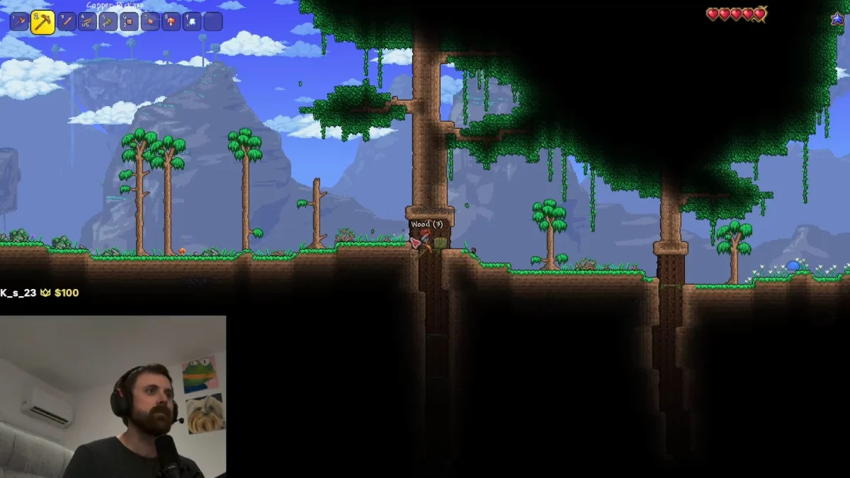 Terraria player chops trees in a jungle forest livestream
