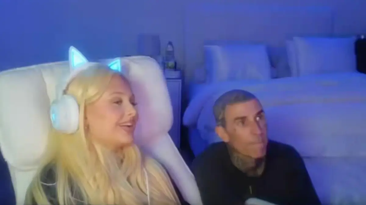 Woman wearing glowing cat-ear headphones beside seated man