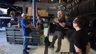 People discussing in an auto repair workshop