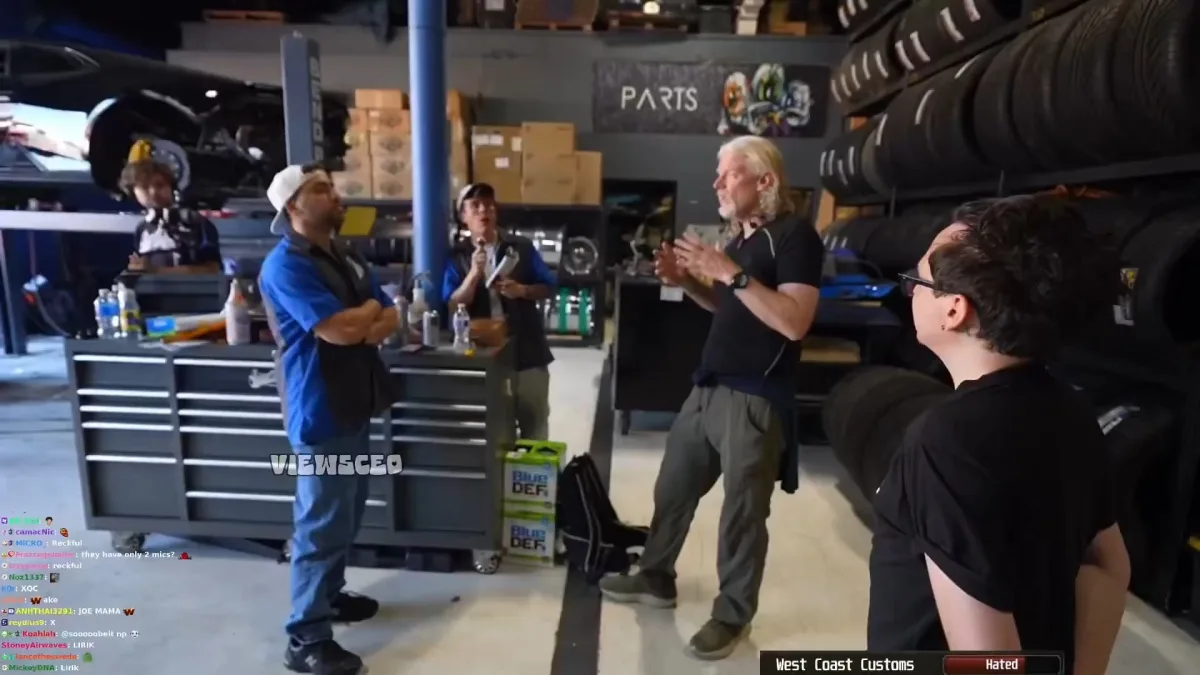 People discussing in an auto repair workshop