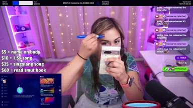 Streamer drawing on face during live broadcast.